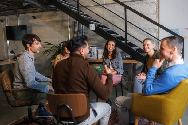 istock Group of people sitting in a circle and talking 2138646717