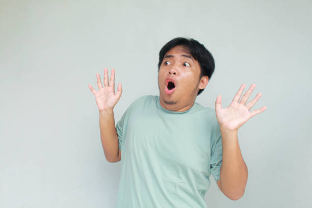 istock Young asian man with shocked and wow expression. 2138656081