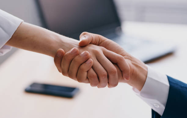 istock Business people shake hands at work In the office employees are mutual understanding 2138682795