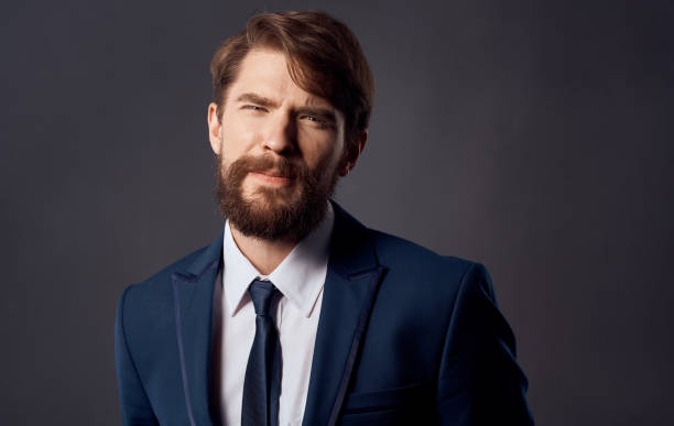 istock Bearded man in suit emotions gestures with hands close-up Studio 2138683304