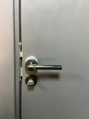 Locked door. Front view doorknob and lock with copy space