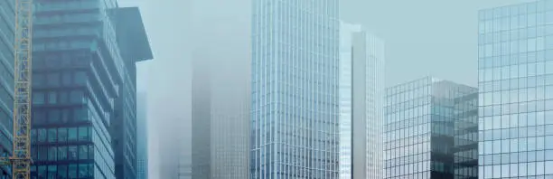 panorama buildings disappear into the mist, creating mysterious and atmospheric urban landscape with blurred outlines and obscured details, Weather Conditions, German Engineering