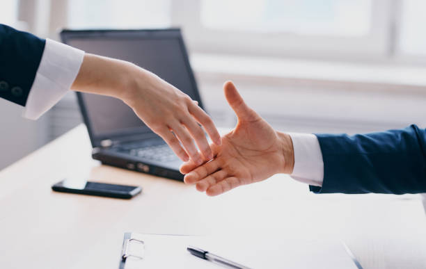 istock Business people shake hands at work In the office employees are mutual understanding 2138696268