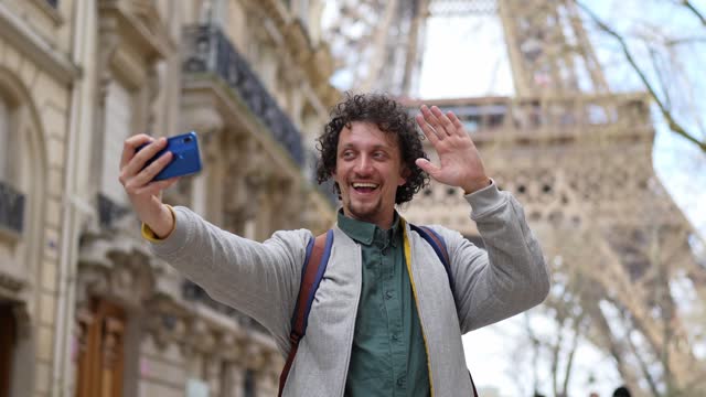 Adult Male Tourist Taking Selfies With The View Of Eiffel Tower In Paris, France