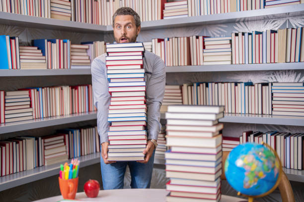 school education with man teacher. education and knowledge. back to school. teachers day. teachers education in school. knowledge day. Literary adventure. man get university education