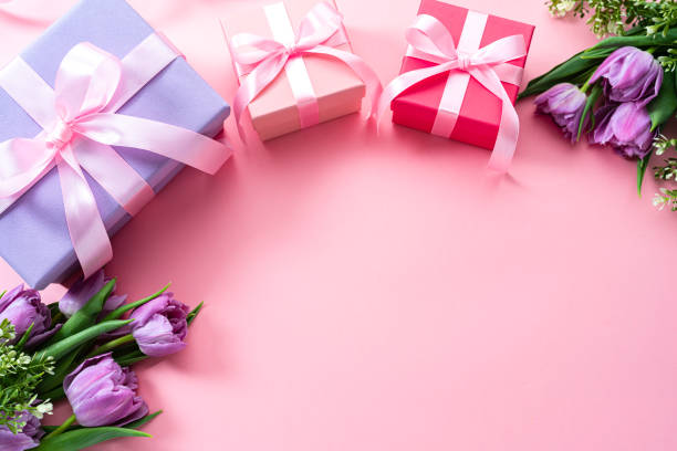 istock Mother's Day border with three gift boxes and tulips 2138702661