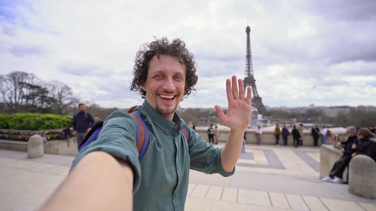 Adult Male Tourist Taking Selfies With The View Of Eiffel Tower In Paris, France