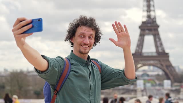 Adult Male Tourist Taking Selfies With The View Of Eiffel Tower In Paris, France