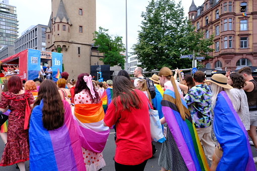 People with rainbowflags parade through downtown Frankfurt as part of CSD parade, Pride Month, fight for sexual diversity, against discrimination and attacks on queer people, FRANKFURT - July 15, 2023