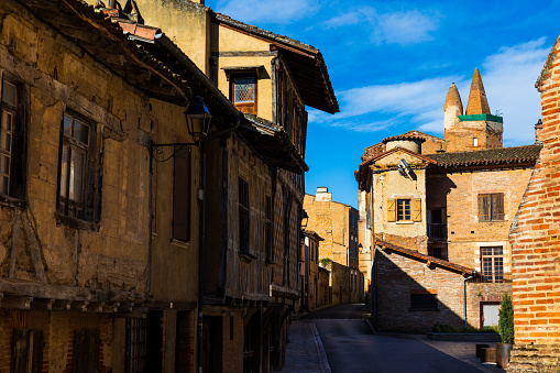 Bishop's Street in the small medieval town of Rieux-Volvestre, characterized by the use of red brick