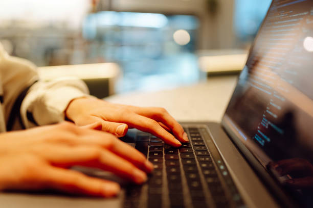 istock Close-up of hands working on a laptop keyboard. 2138763569