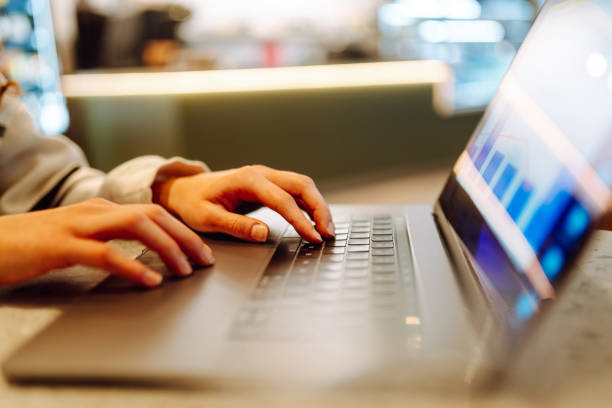 istock Close-up of hands working on a laptop keyboard. 2138763574