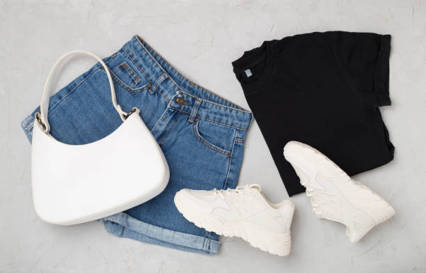 istock Flat lay with trendy spring outfit and flowers on concrete background 2138764612