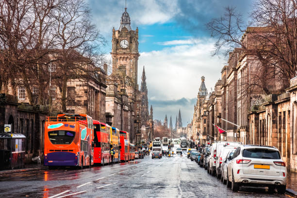 Cars and tourist buses parked along Princes Street in Edinburgh, Scotland