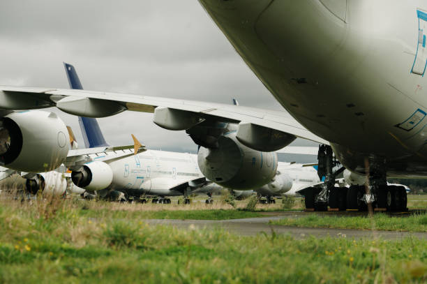 Large obsolete passenger airplanes in a dismantling and recycling facility