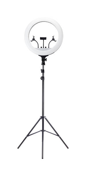 istock LED ring light on tripod with three phone holders isolated from background 2138781434