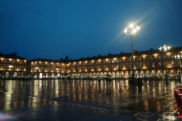 Montauban, France - march 26 2023: Place Nationale and its central pond. Photography taken in Montauban, France