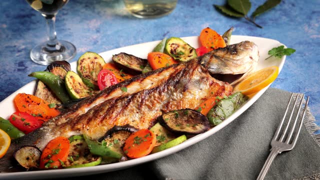 Sea bass grilled fish with veggies