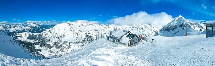 Obertauern panorama, Salzburg area, Austria - Ski resort, hut, skiers and slope in Austrian Alps