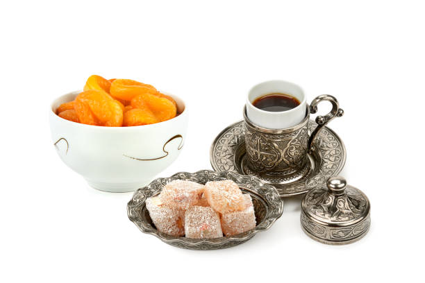 Coffee, Turkish delight and dried apricots isolated on white background. Collage.