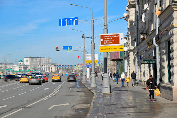 Moscow, Russia - April 4, 2024: Multiple lane road on Bolnaya Polyanka street in the direction of Small Kamenny Bridge. Road markings with Right turn sign. Also on photo road signs No Entry, Lane directions.
