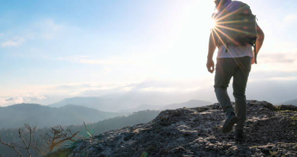 istock Mature hiker arrives on mountain top at sunset 2138867204