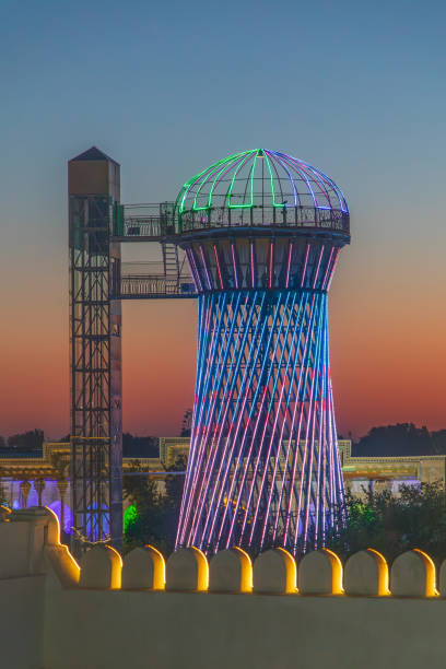 Bukhara, Uzbekistan, Central Asia. August 25, 2021. Colorfully illuminated water tower in Bukhara.