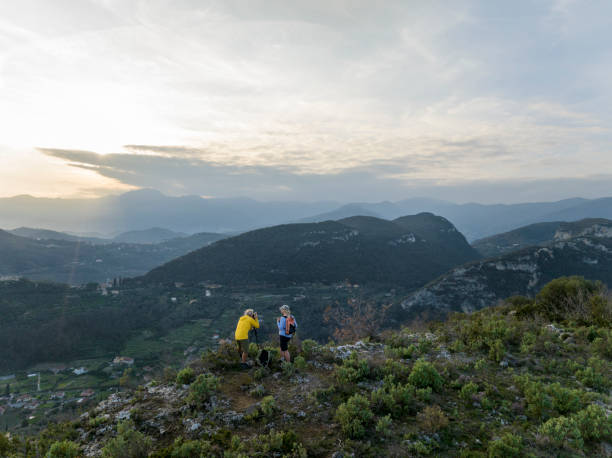 istock Mature couple take photos on mountain top 2138868295