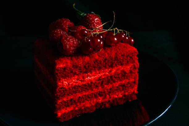 istock Red velvet cake with berries on a plate on a blue background 2138868323