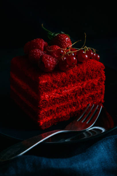 istock Red velvet cake with berries on a plate on a blue background 2138868327