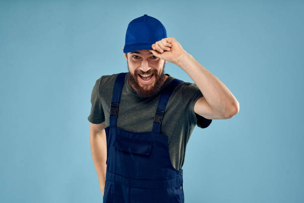 Man in working uniform emotions in life delivery service work. High quality photo