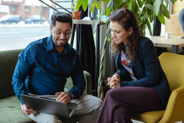 istock Two coworkers working together in office 2138872456
