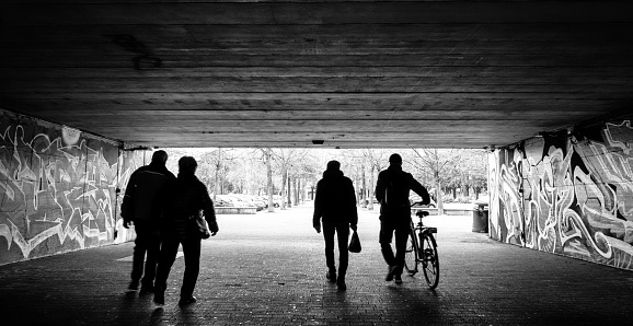 Legnano, Italy - April 04, 2024: some people cross the underpass