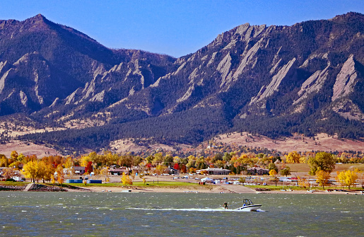 Water skiing on the Boulder, Colorado reservoir with the Flatirons in the background