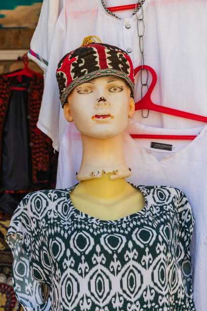 Khiva, Xorazm Region, Uzbekistan, Central Asia. Mannequin wearing a kufi skull cap in Khiva.