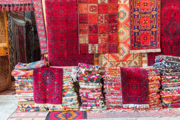 istock Rugs stacked and hanging outside a store in Bukhara. 2138893227