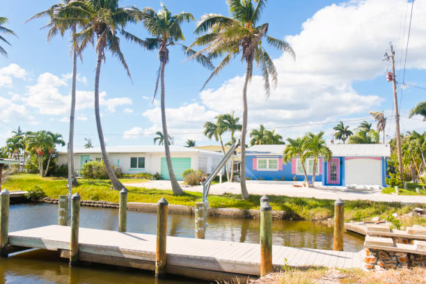 Nice Florida homes with a jetty at an island at the Gulf of Mexico, Florida, USA.