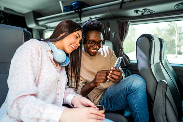 istock Friends traveling by bus and using a smartphone 2138893441