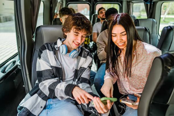 istock Friends traveling by bus and using a smartphone 2138895710