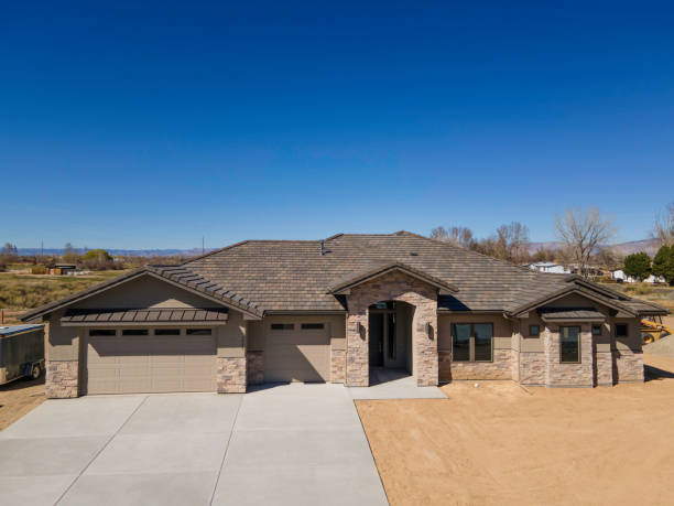 istock Drone View Exterior Newly Constructed Executive Modern Home with Stucco, Cultured Stone and Slate Roof 2138898334