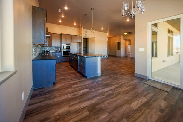 Kitchen remodel with tools and supplies cleaned up. Appliances and countertops in place; custom cabinets, island and window seats nearly complete.