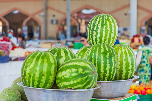 Bukhara, Uzbekistan, Central Asia. Fresh water melons for sale at a market in Bukhara.