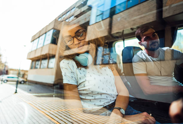 Young tired woman passenger sleeping on a bus