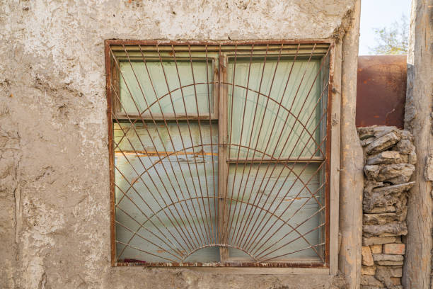 Bukhara, Uzbekistan, Central Asia. Barred window on an old building in Bukhara.