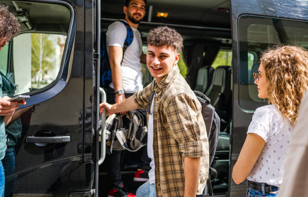 istock Young man boarding a travel bus 2138914969