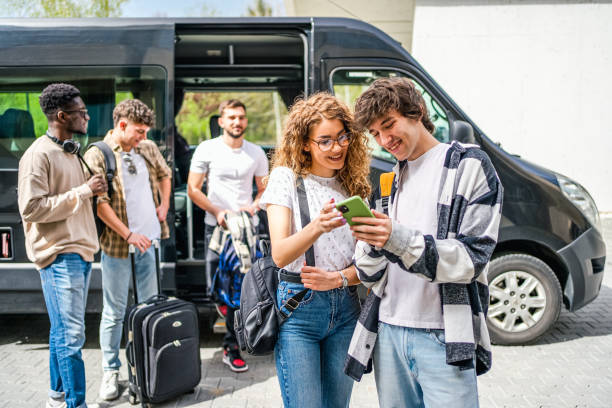 group of young people in front of the bus before the trip - car adventure journey travel photos et images de collection