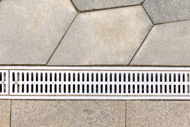 istock Drainage system for water removal. Sewerage system and grate on sidewalk for water drain 2138932068