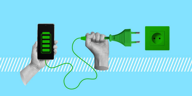 istock Eco-friendly phone charging. Hand with green electric plug and socket, full charge icon on smartphone screen. Minimalist collage 2138932611