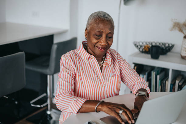 istock Senior woman works from home on her computer 2138932636