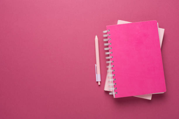 istock Notebooks with stationery on color background, top view 2138933190